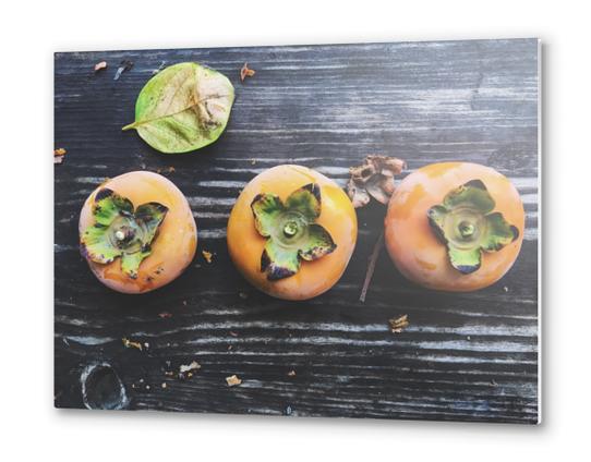 persimmons on the wooden table Metal prints by Timmy333