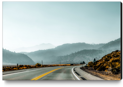 road with mountains and blue sky in California USA Canvas Print by Timmy333