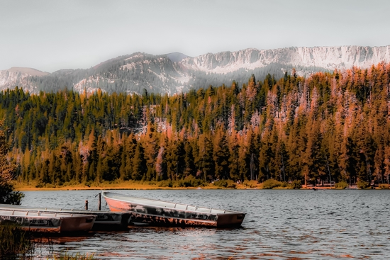 Boat on the lake with pine tree and mountain view background at Mammoth Lakes California USA by Timmy333