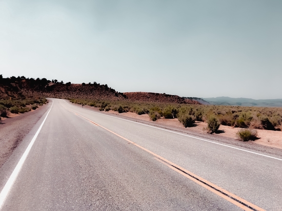 Road with the desert view and blue sky in California USA by Timmy333