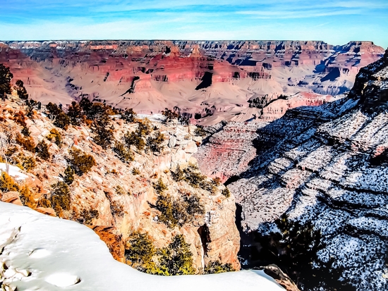 desert at Grand Canyon national park, USA in winter with snow and blue sky by Timmy333