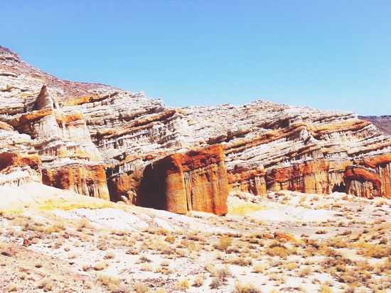 sand desert with orange mountain in California, USA with summer blue sky by Timmy333