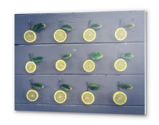 pieces of lemon on the wooden table Metal prints by Timmy333