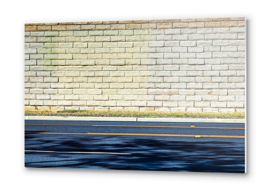 road with shadows and brick wall background Metal prints by Timmy333