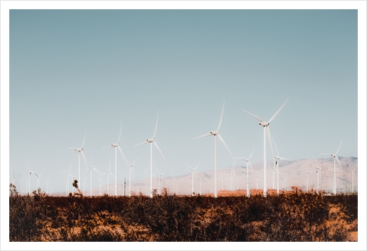 Wind turbine in the desert with summer blue sky at Kern County California USA Art Print by Timmy333