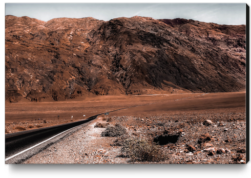 road in the desert with mountain view at Death Valley national park California USA Canvas Print by Timmy333