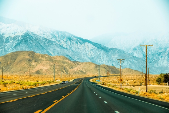 countryside road with mountains and foggy sky view in California, USA by Timmy333