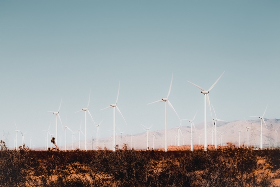 Wind turbine in the desert with summer blue sky at Kern County California USA by Timmy333