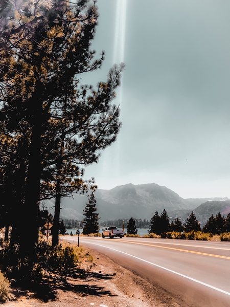 road with mountain and blue sky view at Mammoth Lakes California USA by Timmy333