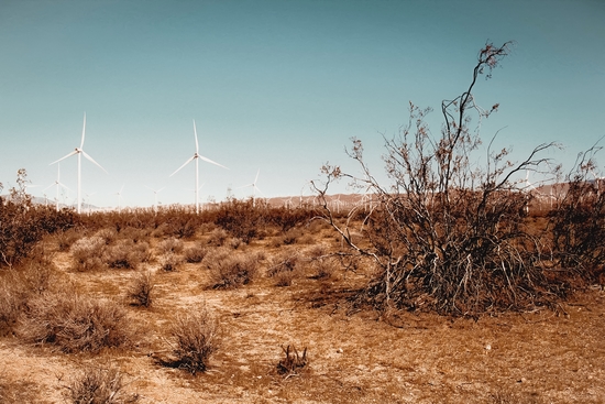 Desert and wind turbine with blue sky at Kern County California USA by Timmy333