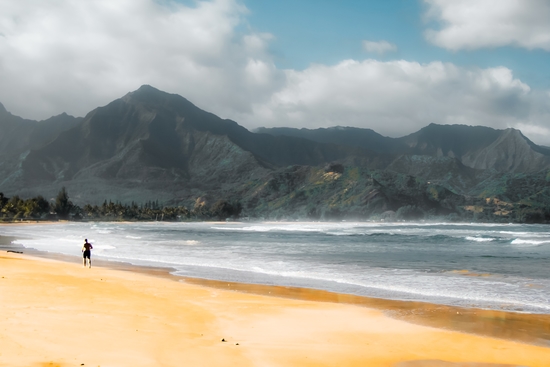 jogging at the beach with green mountain scenic Kauai Hawaii USA by Timmy333