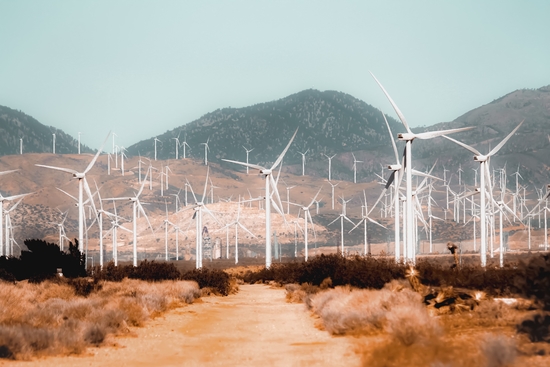 Wind turbine in the desert with mountain background at Kern County California USA by Timmy333