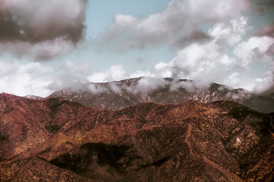 View from the hiking trail with mountain view and blue cloudy sky to Hollywood sign Los Angeles California USA by Timmy333