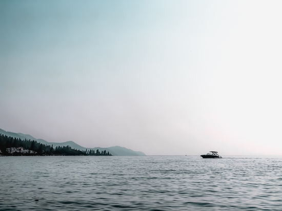 boat on the water with blue sky at Lake Tahoe USA by Timmy333