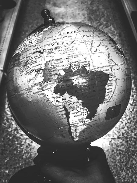 holding globe map in black and white by Timmy333