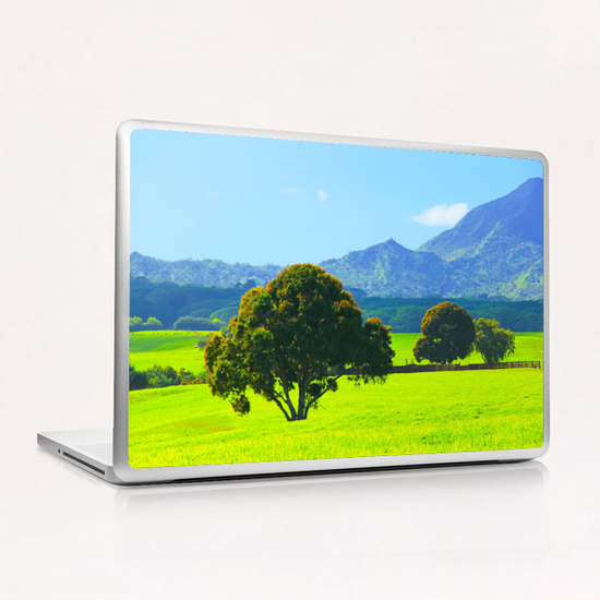 green tree in the green field with green mountain and blue sky background Laptop & iPad Skin by Timmy333